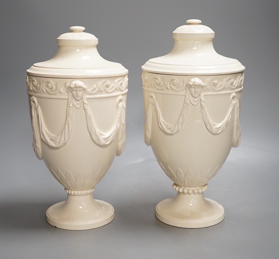 A pair of Wedgwood Etruria creamware vases and covers, c.1900, 28cm tall